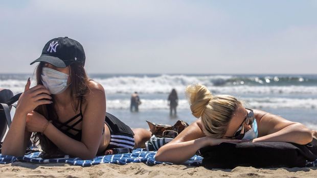 image-https___cdn-cnn_-com_cnnnext_dam_assets_200619065927-01-masks-on-the-beach-0425