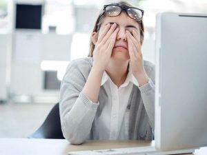 image-woman-rubbing-tired-eyes-computer-gettyimages-830293564
