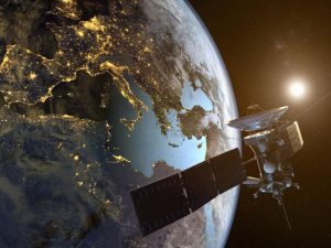 image-a-satellite-orbiting-the-earth-with-illuminated-cities-at-night