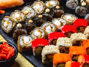 image-side-view-sushi-set-alaska-roll-chuckien-hot-roll-california-with-crab-meat-and-tobiko-caviar-maki-and-philadelphia-with-cream-cheese-on-a-tray-pic_32ratio_900x600-900x600-27640
