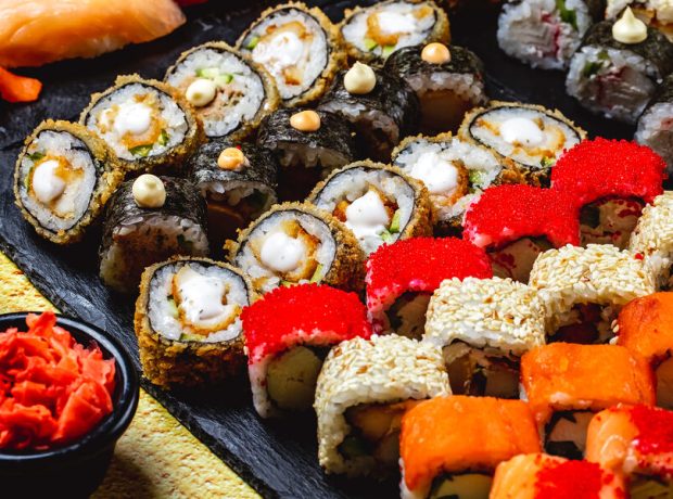 image-side-view-sushi-set-alaska-roll-chuckien-hot-roll-california-with-crab-meat-and-tobiko-caviar-maki-and-philadelphia-with-cream-cheese-on-a-tray-pic_32ratio_900x600-900x600-27640